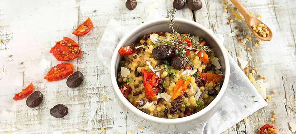Fregola sarda risotto with black olives and tomatoes recipe